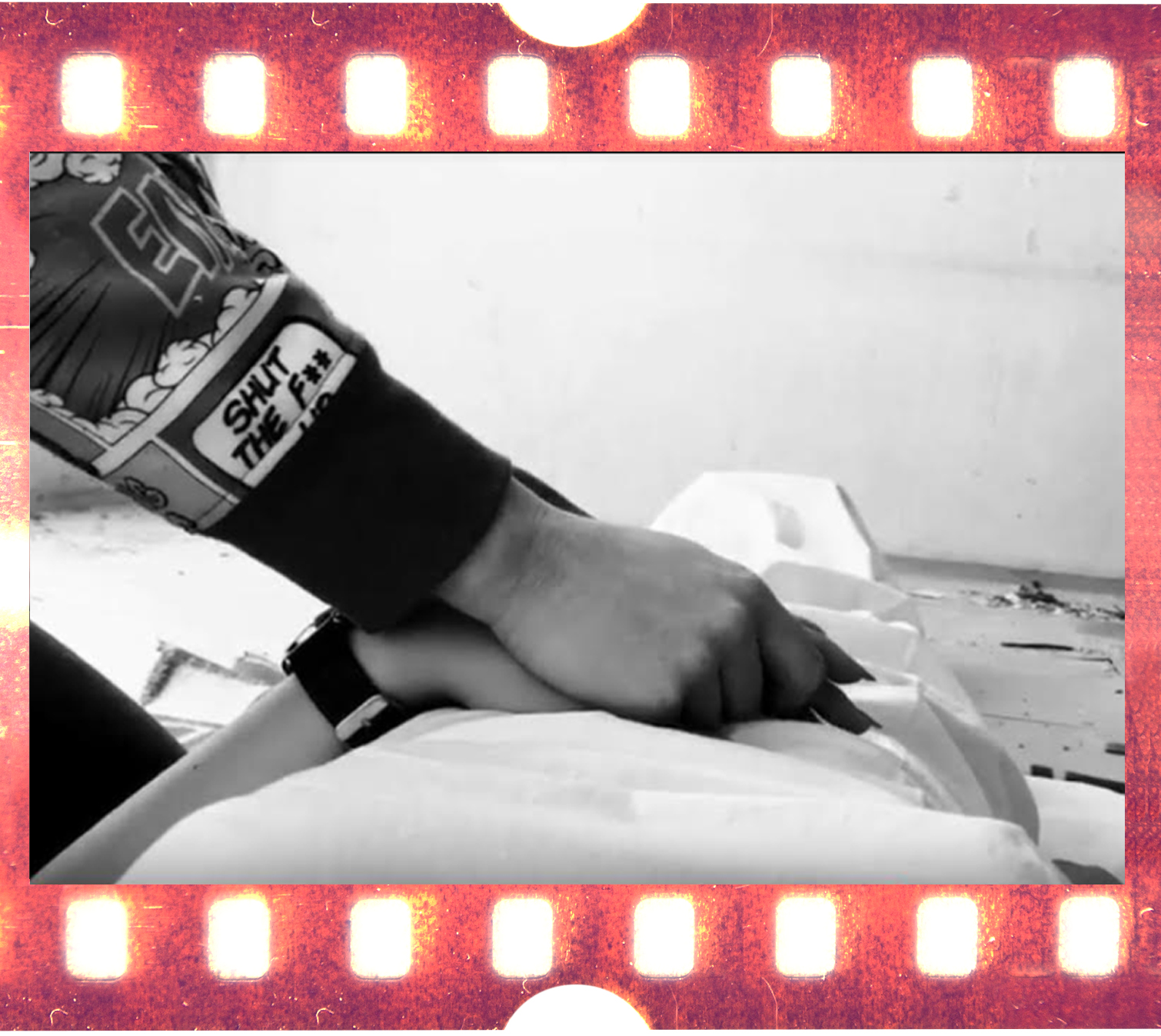 Photographic film on wooden background.